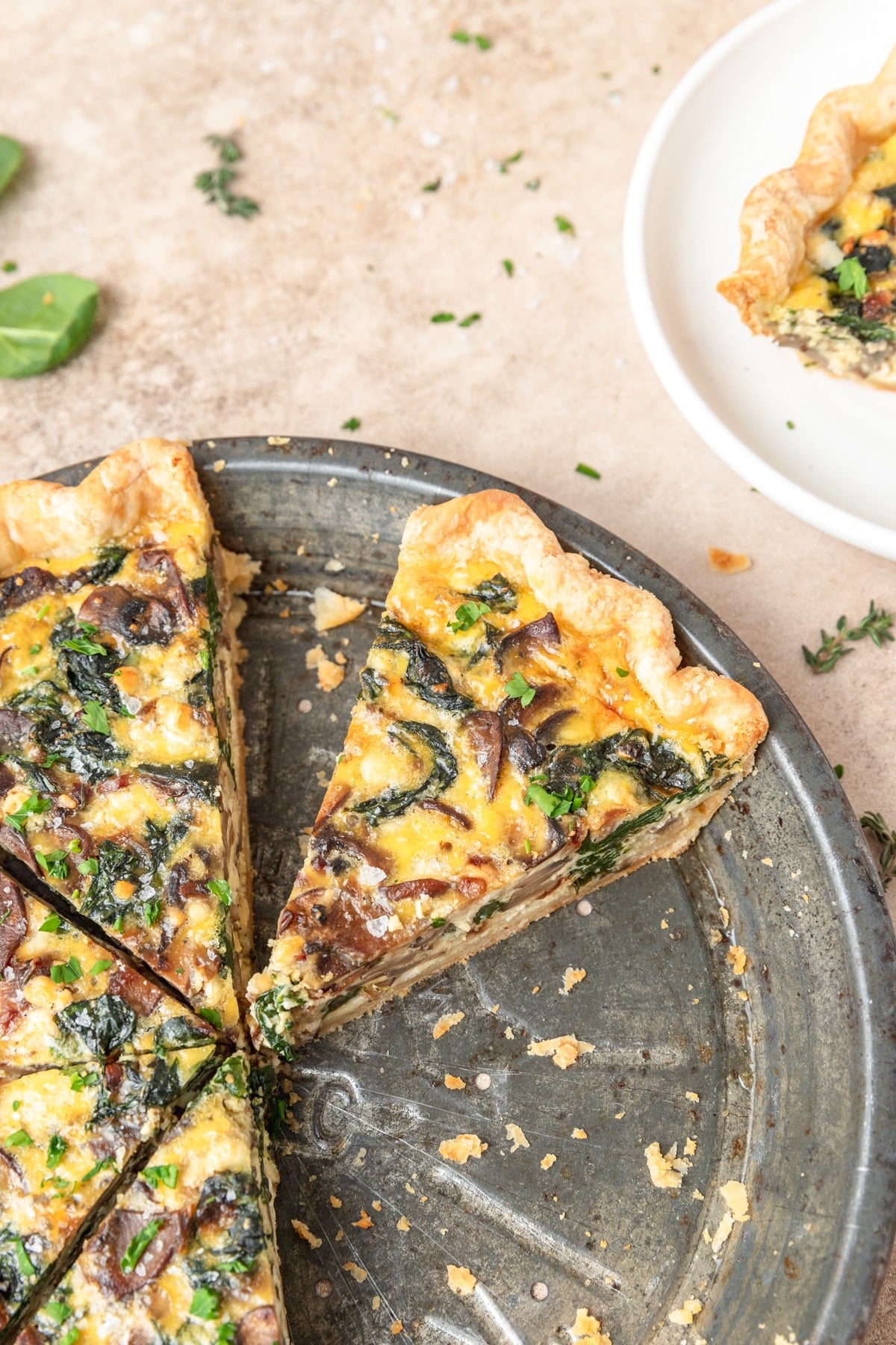 slice of spinach, mushroom, goat cheese quiche.