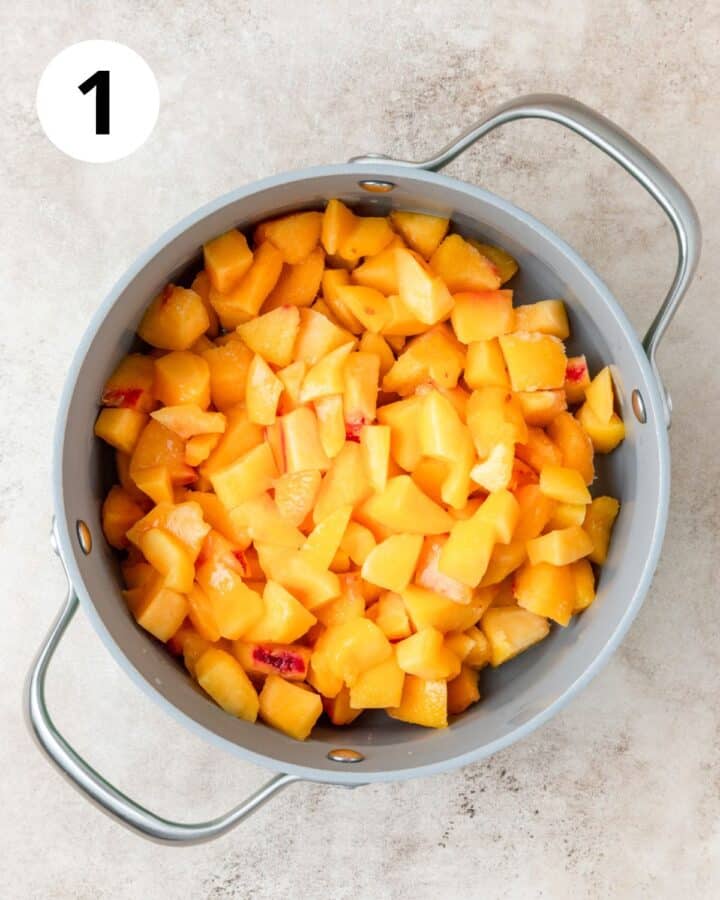 fresh peaches diced in pot.