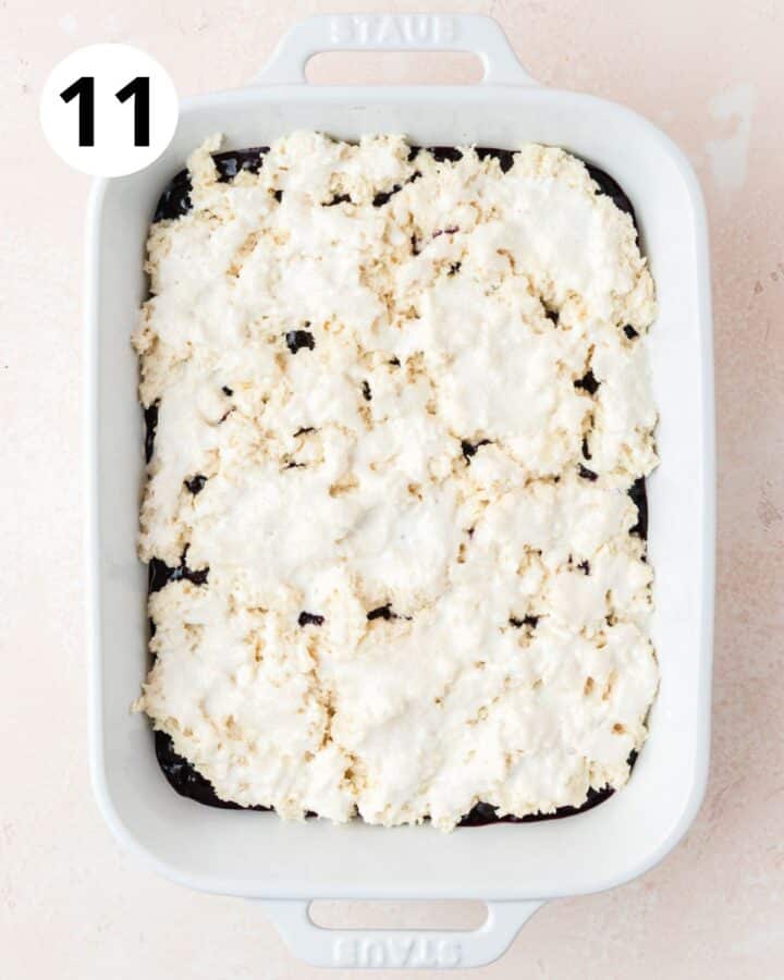 brushing top with cream and sprinkling with sugar.