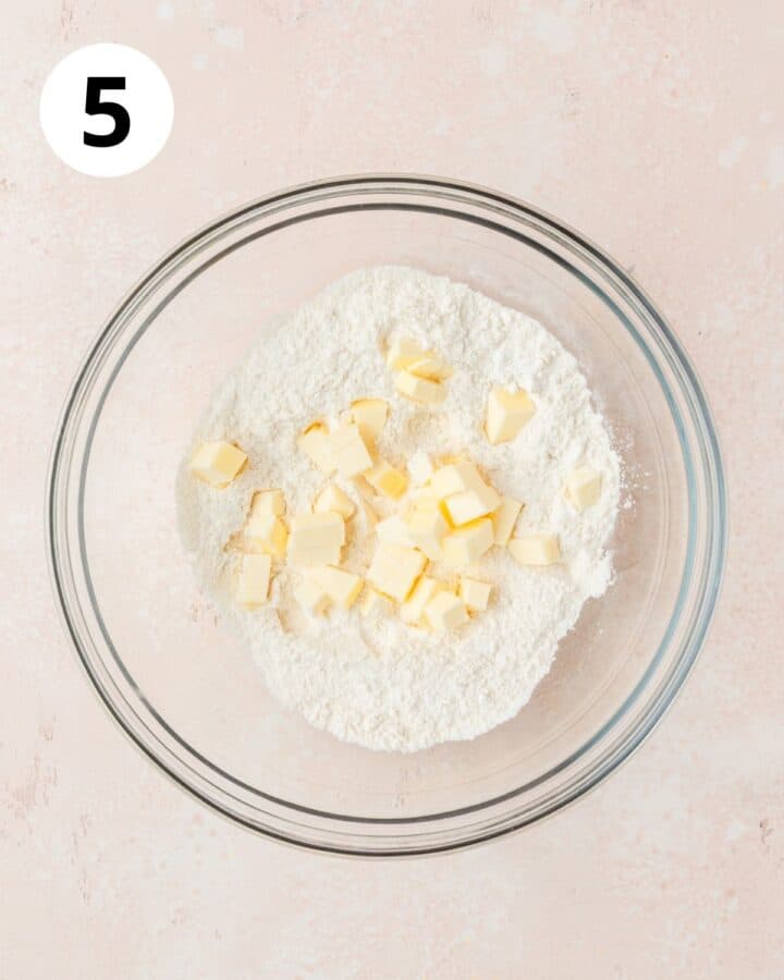 adding butter to dry ingredients. 