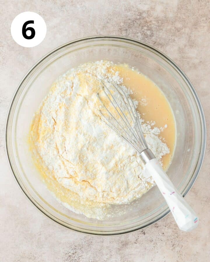 adding dry ingredients to cornbread.