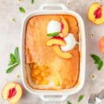 cornbread peach cobbler topped with ice cream.