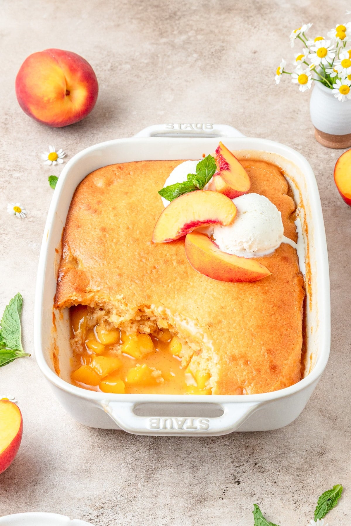 peach cobbler with fluffy cornbread topping.