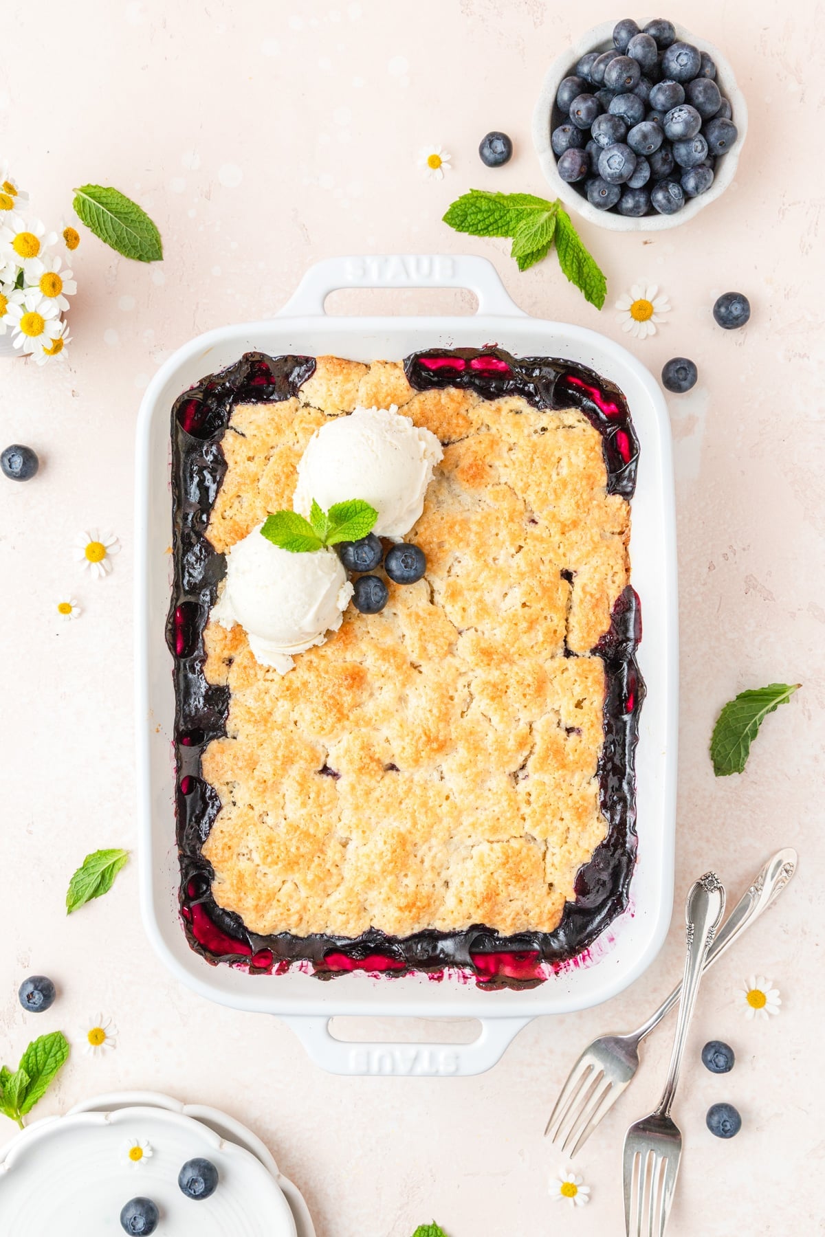 sourdough blueberry cobbler topped with vanilla ice cream.