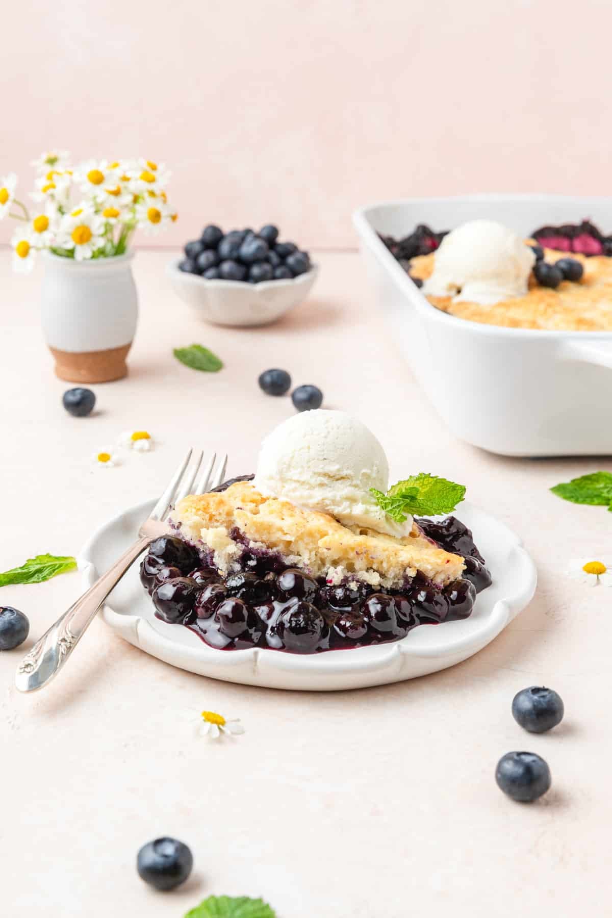 plate of blueberry cobbler with sourdough topping.