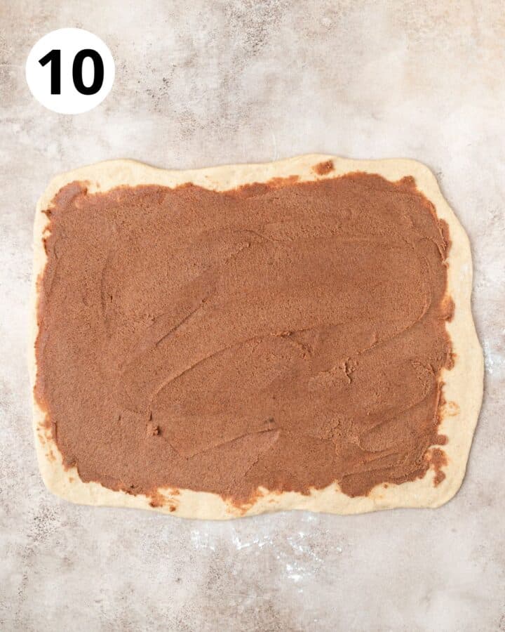 spreading cinnamon sugar butter into even layer.